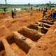 Workers are digging graves at the Paloko cemetery in Waterloo, Sierra Leone August 17, 2017.